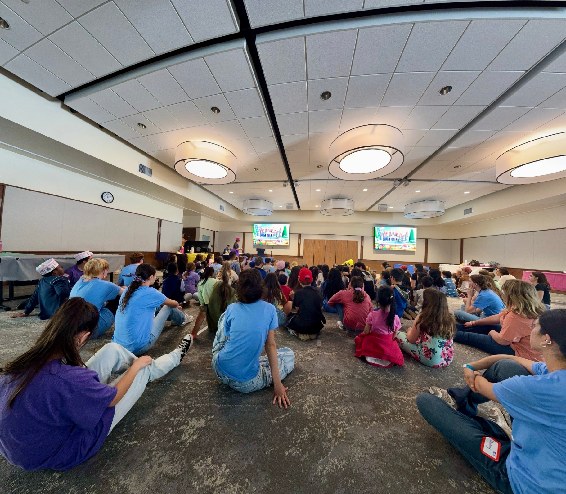 Children enjoying an engaging convention session