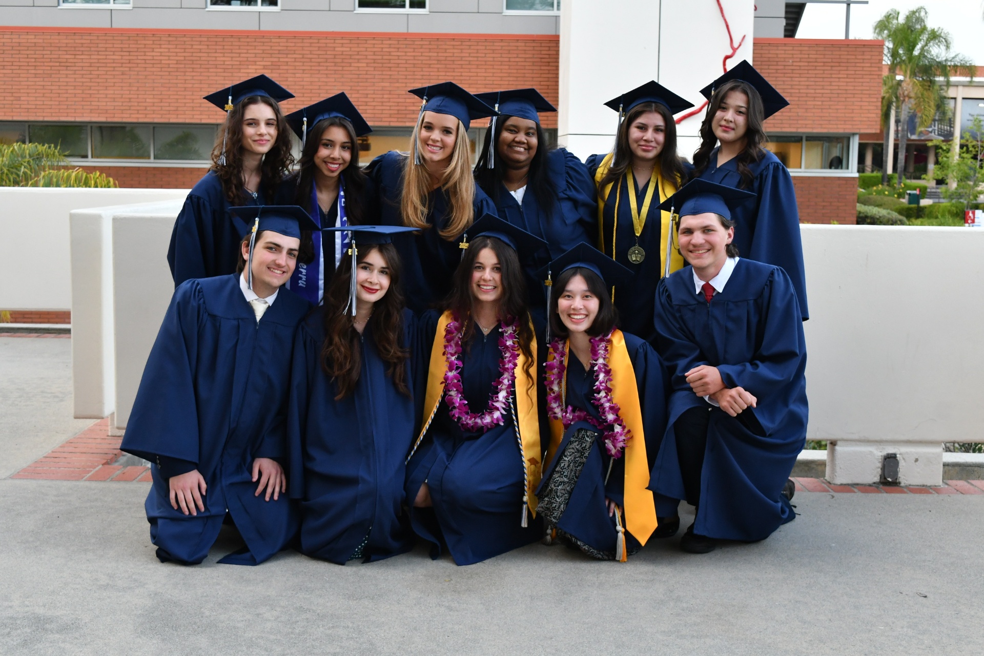 Class of 2025 - Homeschool graduates in blue caps and gowns